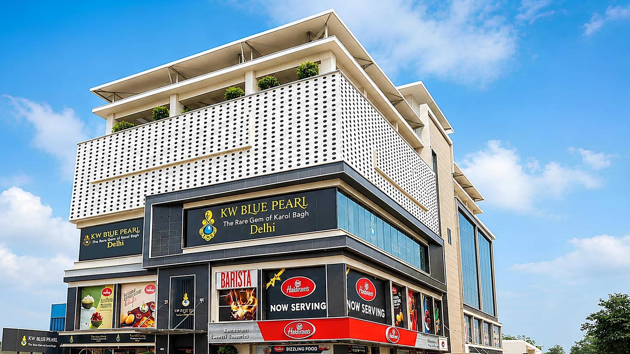 KW Blue Pearl — daylit corner glass facade on DB Gupta Road, Karol Bagh