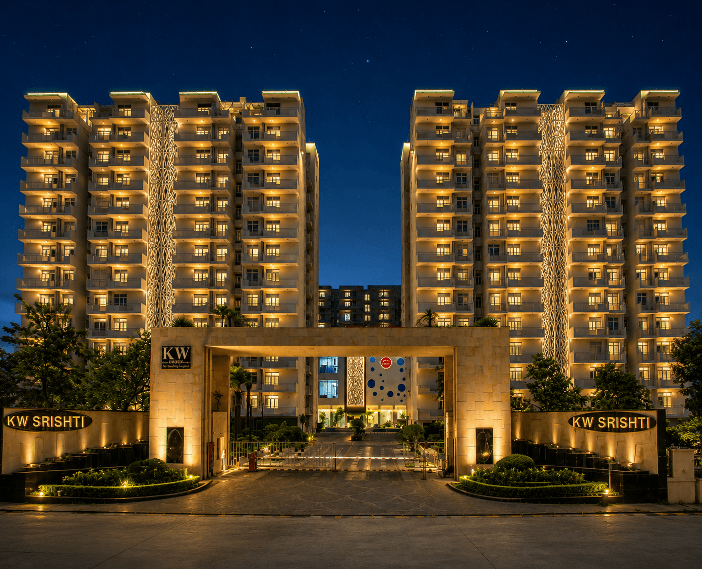 KW Srishti township at night with illuminated facades